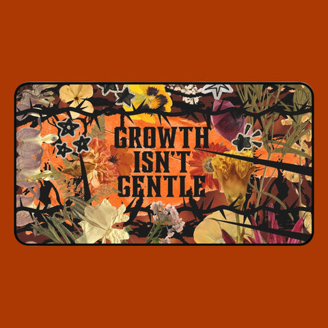 "growth isn't gentle" desk mat