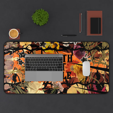 "growth isn't gentle" desk mat