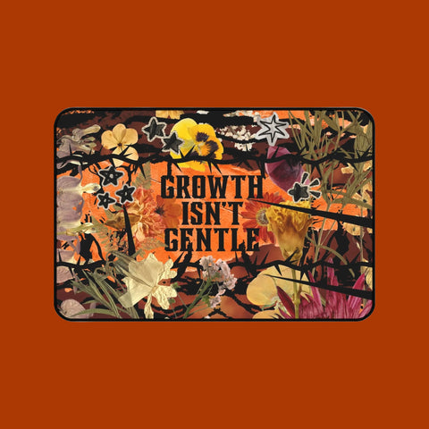 "growth isn't gentle" desk mat