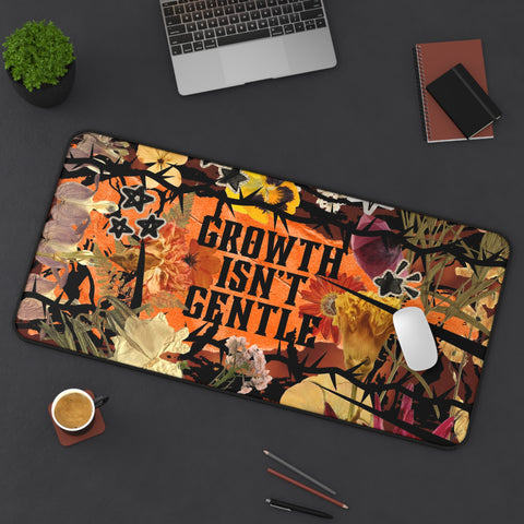 "growth isn't gentle" desk mat