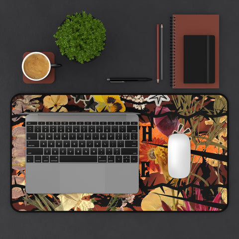 "growth isn't gentle" desk mat