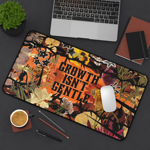 "growth isn't gentle" desk mat